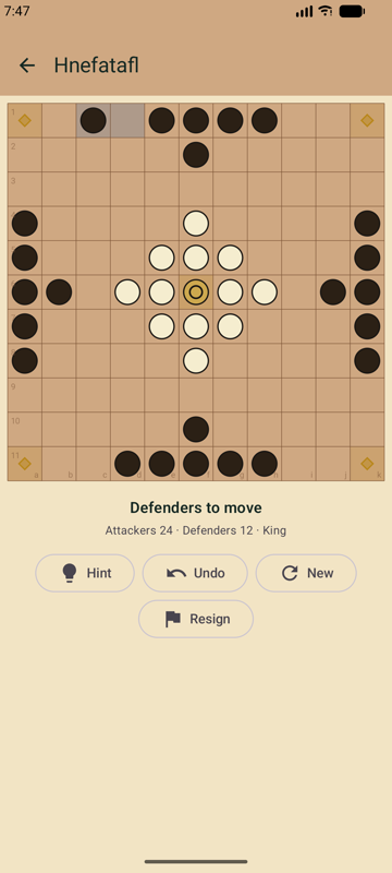 Isle Games Hnefatafl board mid-match on an 11x11 grid with attackers, defenders, and the king in play